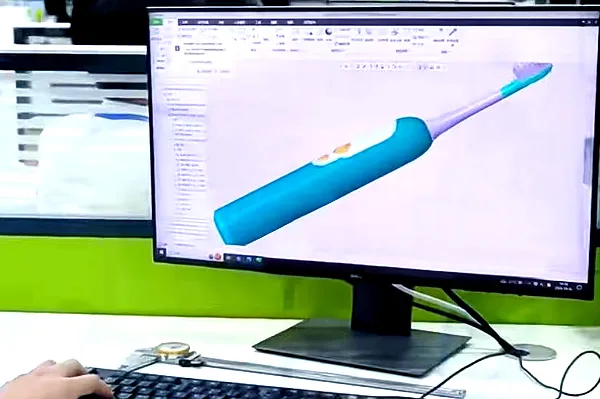 OEM Guide 4 Engineers conducting structural verification and 3D modeling review for electric toothbrush manufacturability.