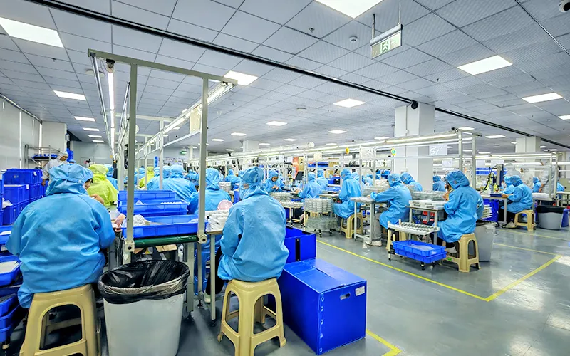 Sustainable Development 10 Relish manufacturing team working in a clean, well-lit assembly line, reflecting a respectful and supportive workplace environment.